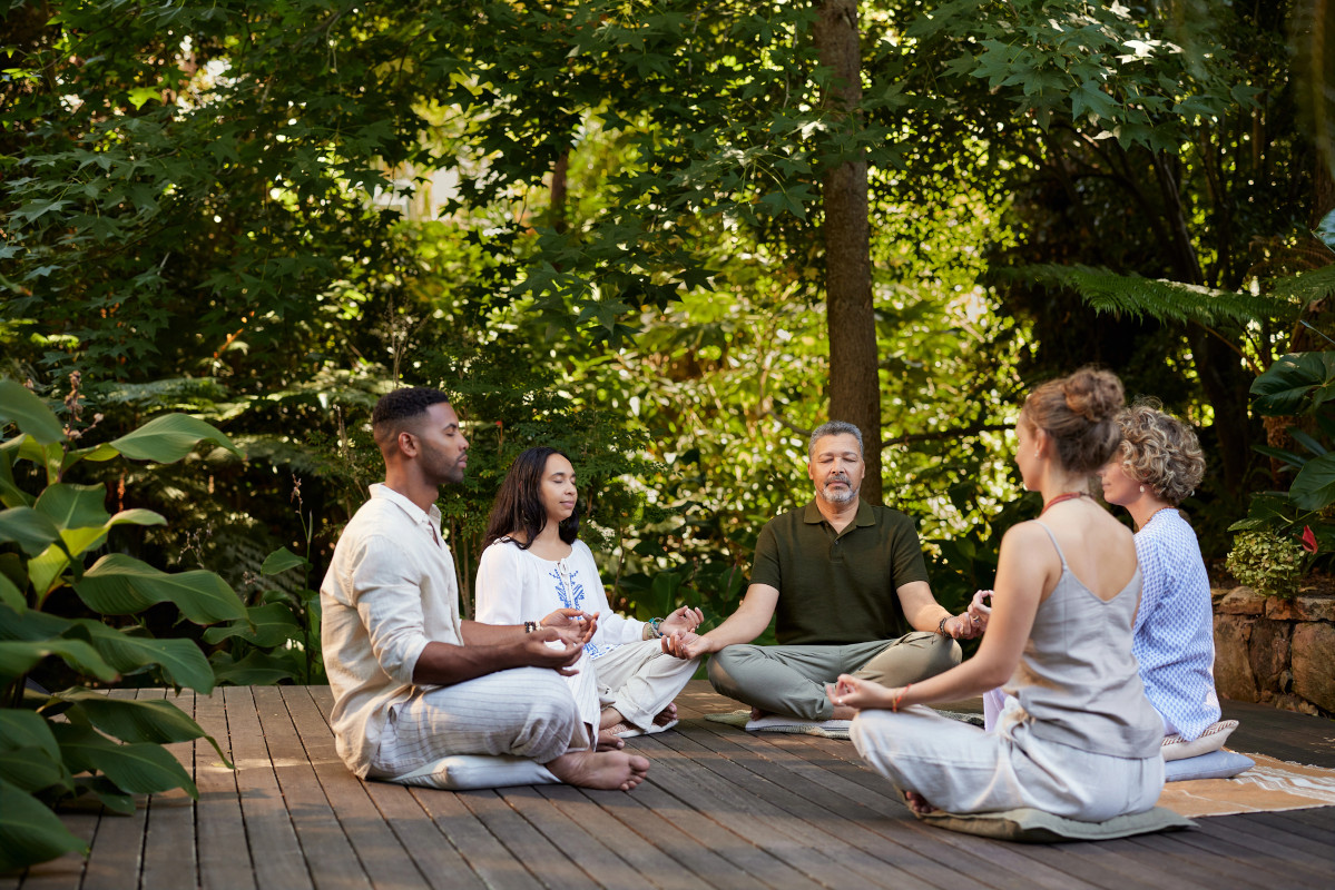 group meditating outside